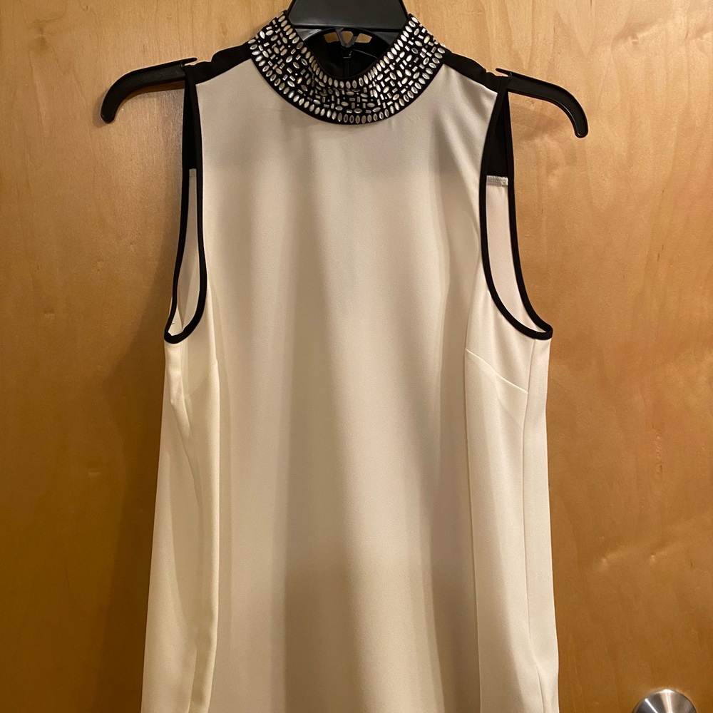 Elegant Sleeveless Top with Embellished Collar